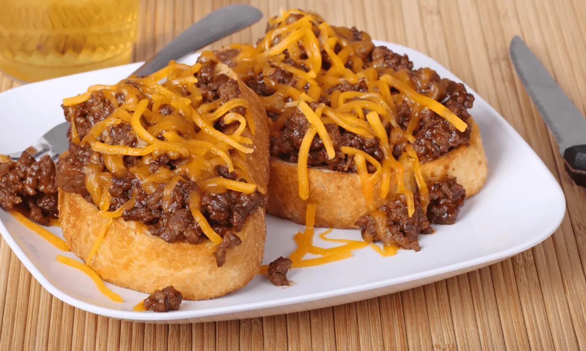 Texas Toast Sloppy Joes topped with beef and melted cheddar cheese.