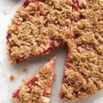 Keto Rhubarb Crumble Tart with almond flour crust and crumble topping