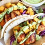 Baja Fish Tacos with Mango Slaw and Avocado Crema